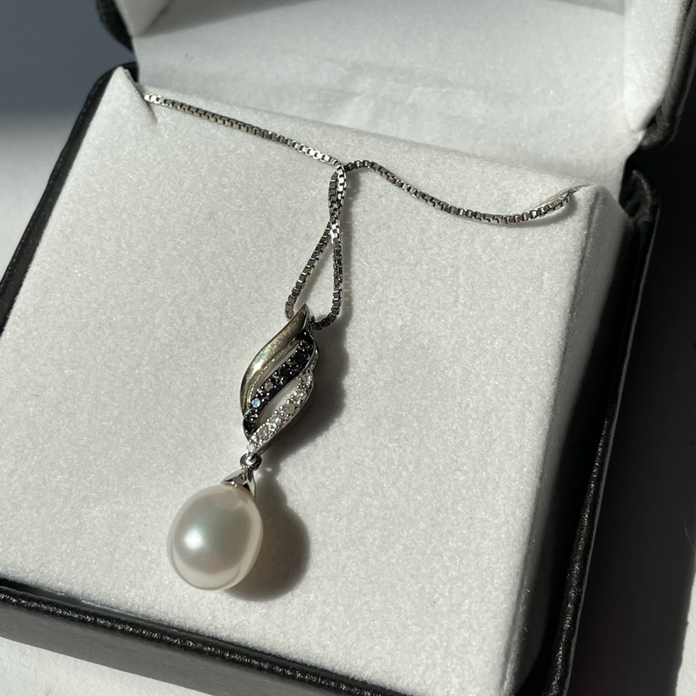 Silver necklace.